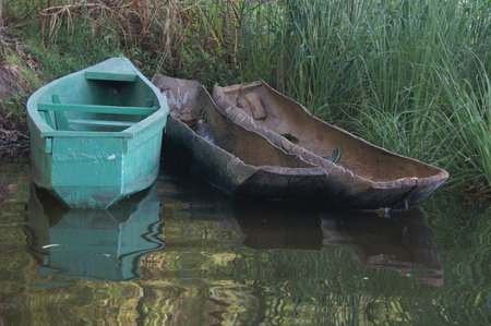 Boats on the river bank in Uganda, Africaの写真素材