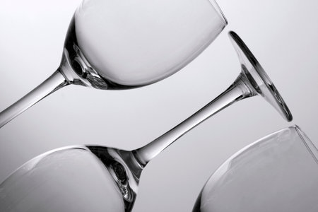 A close-up of wine glasses in black and whiteの写真素材