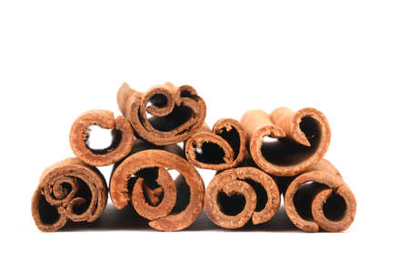 Cinnamon sticks isolated on whiteの写真素材