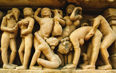 Famous erotic carvings at ancient Lakshmana Temple in Khajuraho, Madya Pradesh, India.の写真素材