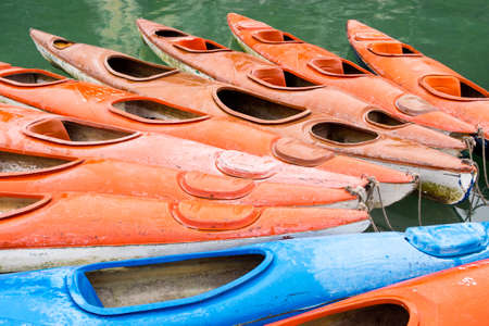 Colorful kayaks in the waters of Halong Bay, North Vietnamの写真素材