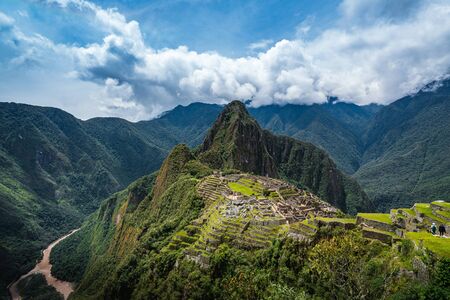 Ancient Inca ruins of Machu Picchu on a sunny day, Cusco Region, Peru.の写真素材