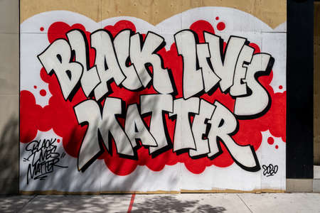 Toronto, Canada - June 6, 2020: Boarded up storefront in Downtown Toronto showing Black Lives Matter message painted out front in support of social movement against racial injustice in America.のeditorial素材