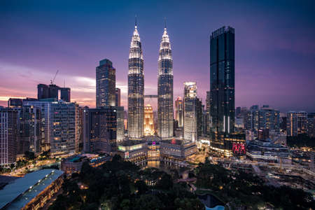 Kuala Lumpur City Centre aka KLCC complex including national landmark Petronas Twin Towers at twilight in Kuala Lumpur, Malaysia.のeditorial素材