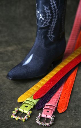 western colorful belts and a cowboy bootの写真素材
