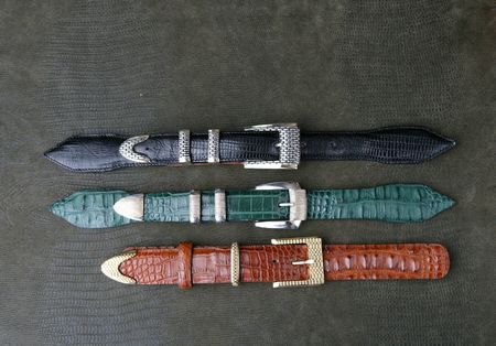three belt buckles handcrafted of gold ans silverの写真素材
