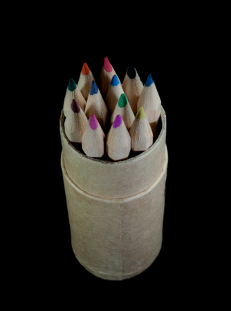 Colored pencils in a pencil case on black backgroundの写真素材