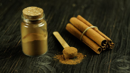 cinnamon ground sticks ceremony cocoa cloves ground coffee spices on wooden table closeupの写真素材