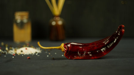 hot dry chili peppers fresh cherry tomatoes salad ingredients rustic kitchenの写真素材