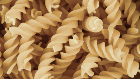 pasta in a dish dry appetizing spiral macaroni in the kitchen food preparationの写真素材
