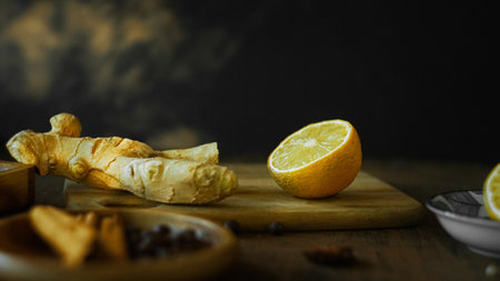 Ginger tea ingredients ginger lemon cinnamon clove saffron sage rustic close-upの写真素材