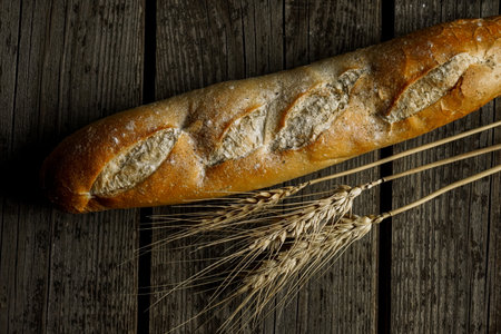 Fresh bread baguette loaf with seeds in a rustic style. Baking homemade healthy breadの写真素材
