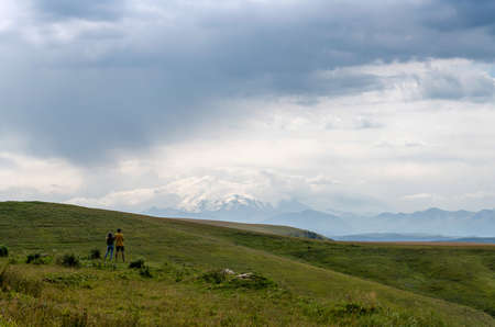 The couple looks at Mount Elbrusの写真素材