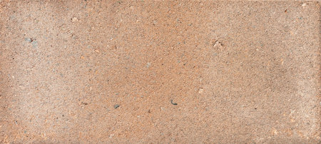 The texture of the brick is coarsely enlarged