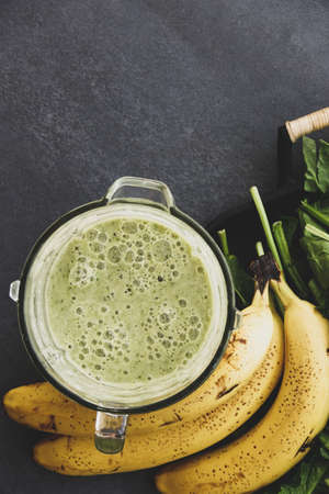 Healthy Green Smoothie in Glass on Grey Background Copy Spaceの写真素材