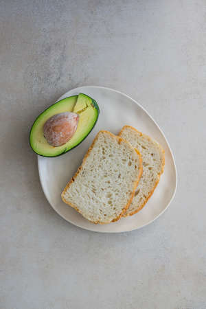 Avocado and Bread Healthy Sandwich Ingredient on Plate Top View