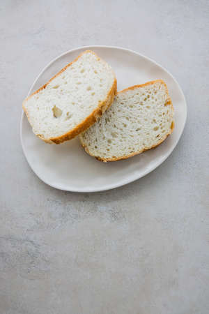Two Slice Bread on Plate Top View Flat Lay Copy Space Monochrome Designの写真素材