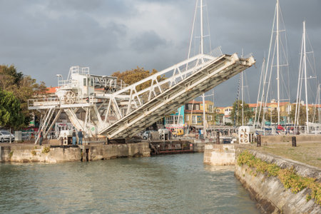 LA ROCHELLE, FRANCE - OCTOBER 02, 2012  Moveable Bridge at the entry of the old port in La Rochelle, France  La Rochelle is a city in western France and a seaport on the Bay of Biscayのeditorial素材