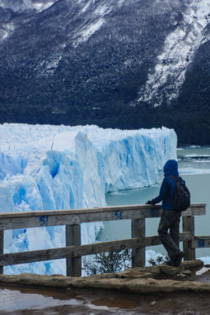 Calafate, Argentina - September 26, 2009  A tourist looking at the Perito Moreno Glacier  The Perito Moreno Glacier is a glacier located in the Los Glaciares National Park in southwest Santa Cruz province, Argentina  It is one of the most important tourisのeditorial素材