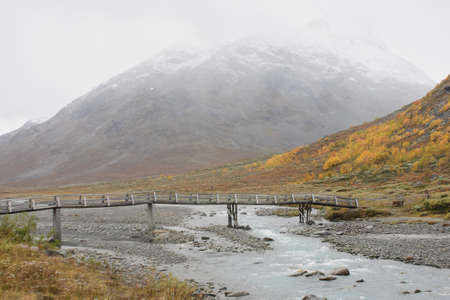 View and an old wooden bridge, near road 55, Norwayの写真素材