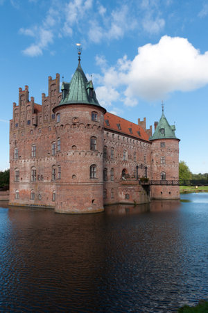 Egeskov castle and reflection in the lake  A castle in Denmarkのeditorial素材