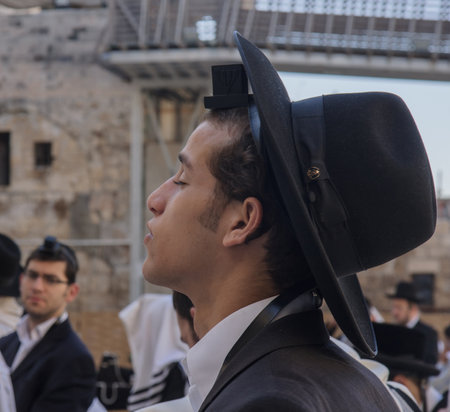 JERUSALEM - JULY 31 - Orthodox Jews prays at the Western Wall - July 31, 2013 in the old city of Jerusalem, Israel  The western wall is the holiest place in Jewish traditionのeditorial素材