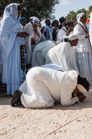 JERUSALEM - OCT 31  Ethiopian Jewish women kneel in pray at the Sigd - Oct  31, 2013 in Jerusalem, Israel  The Sigd is an annual holyday of the Ethiopian Jews のeditorial素材