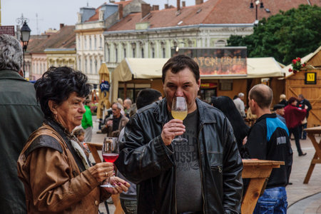 PECS, HUNGARY - SEP 27  People enjoy wine tasting at the Pecsi Pezsgo Borfesztival in Pecs, Hungary on September 27, 2013  This annual event is the biggest wine festival in Pecsのeditorial素材