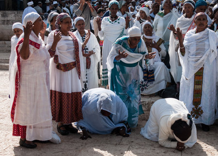 JERUSALEM - OCT 31  Ethiopian Jewish women kneel in pray at the Sigd - Oct  31, 2013 in Jerusalem, Israel  The Sigd is an annual holyday of the Ethiopian Jews のeditorial素材