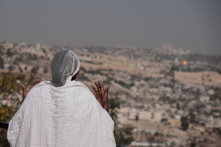 JERUSALEM - OCT 31  Ethiopian Jewish woman prays, facing the old city, at the Sigd - Oct  31, 2013 in Jerusalem, Israel  The Sigd is an annual holyday of the Ethiopian Jews のeditorial素材