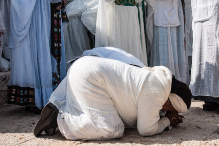 JERUSALEM - OCT 31  Ethiopian Jewish women kneel in pray at the Sigd - Oct  31, 2013 in Jerusalem, Israel  The Sigd is an annual holyday of the Ethiopian Jews のeditorial素材
