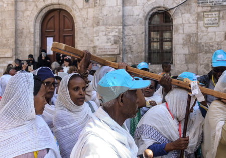 JERUSALEM - APRIL 18, 2014  Pilgrims from all over the world commemorating the crucifixion of Jesus Christ by carrying a cross along via dolorosa, on good Friday, in the old city of Jerusalem, Israelのeditorial素材