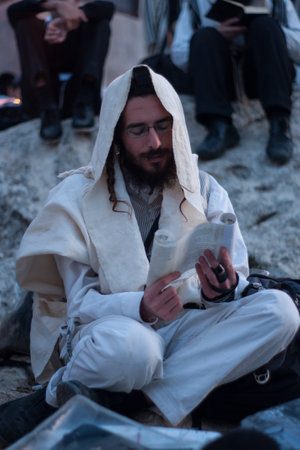 MERON, ISRAEL - MAY 18, 2014  Orthodox Jews prays a sunrise  Shacharit  pray at the annual hillulah  celebration  of Rabbi Shimon Bar Yochai, in Meron, on Lag BaOmer Holiday のeditorial素材