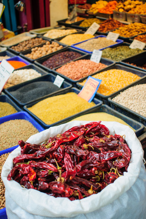 Dried red chili peppers and other herbs on sale in the marketの写真素材