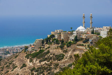 The Kababir neighborhood and the Mahmood Mosque, with the Mediterranean sea in the background  Haifa, Israelの写真素材