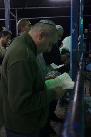 SAFED, ISRAEL - OCTOBER 03, 2014: Jewish men pray Selichot (request for forgiveness) at the tomb of The ARI (Rabbi Isaac Luria), on Yom Kippur eve, in Safed, Israel.のeditorial素材