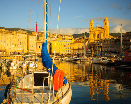 BASTIA, FRANCE - OCTOBER 16, 2014: Scene of the old port (the Vieux Port) at sunrise, in Bastia, Corsica, France. Bastia is the biggest city in Corsicaのeditorial素材