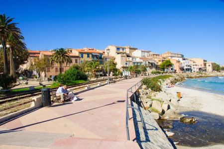 L-ILE-ROUSSE, FRANCE - OCTOBER 18, 2014: Scene of the main square and the beach in L-ile-Rousse, The Balagne, Corsica, Franceのeditorial素材