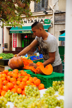 MARSEILLES, FRANCE - OCTOBER 20, 2014: Sellers and shoppers in the Capucins food market, in Marseilles, France. Marseilles is the second largest city in Franceのeditorial素材