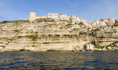 The cliffs, buildings, city wall and the Stairway of the King of Aragon, in Bonifacio, Corsica, Franceの写真素材