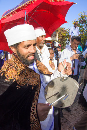 JERUSALEM - NOV 20, 2014: A Kes, religious leader of the Ethiopian Jews, plays a drum to mark the end of the Sigd prays, in Jerusalem, Israel. The Sigd is an annual holiday of the Ethiopian Jewsのeditorial素材