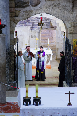 NAZARETH, ISRAEL - December 19, 2014: Praying ceremony in the Church of Annunciation, in Nazareth,...