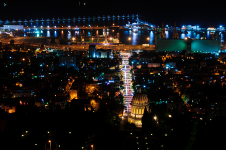 The Bahai shrine and gardens, with the German Colony, decorated for the holidays, and the harbor in the background. Haifa, Israelの写真素材