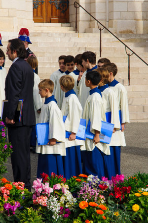 MONACO-VILLE, MONACO - JAN 27, 2015: Priests and local youths march out of the cathedral after the...