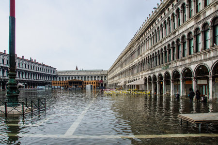 VENICE, ITALY - FEB 03, 2015: Scene of the flooded Piazza San Marco, with local and tourists, in Venice, Veneto, Italyのeditorial素材