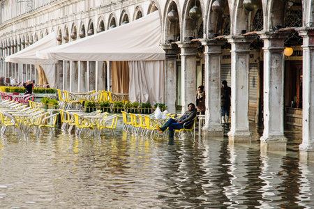VENICE, ITALY - FEB 03, 2015: Scene of the flooded Piazza San Marco, with local and tourists, in Venice, Veneto, Italyのeditorial素材