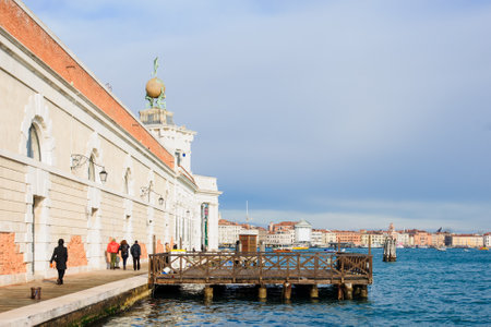 VENICE, ITALY - FEB 04, 2015: Scene of Punta della Dogana, with local and tourists, in Venice, Veneto, Italyのeditorial素材