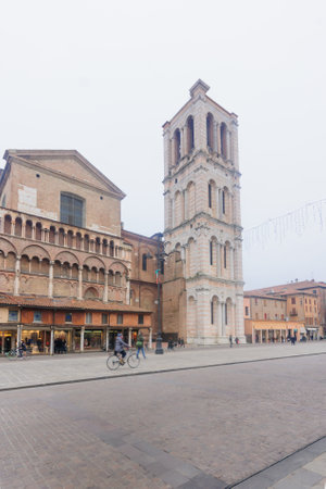 FERRARA, ITALY - JAN 20, 2015: Scene of the Piazza Trento e Trieste and the cathedral tower, with local and tourists, in Ferrara, Emilia-Romagna, Italyのeditorial素材