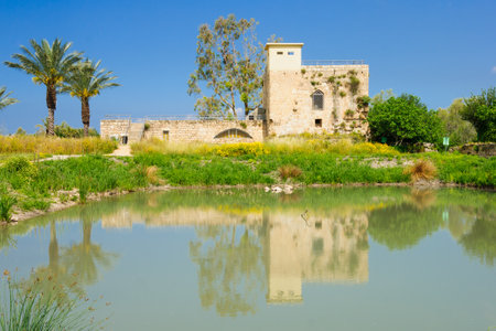 A restored Crusader-era flour mill building, and a water pond, in En Afek Nature Reserve, northern Israelのeditorial素材