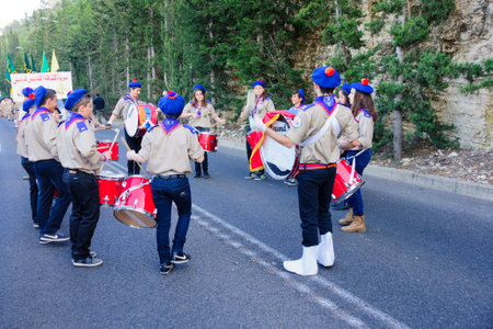 HAIFA, ISRAEL - APR 19, 2015: A group of Christian scouts takes part in the annual our lady of Mount Carmel parade, in Haifa, Israel. This annual event commemorates the hiding of Mary statue in WWIのeditorial素材
